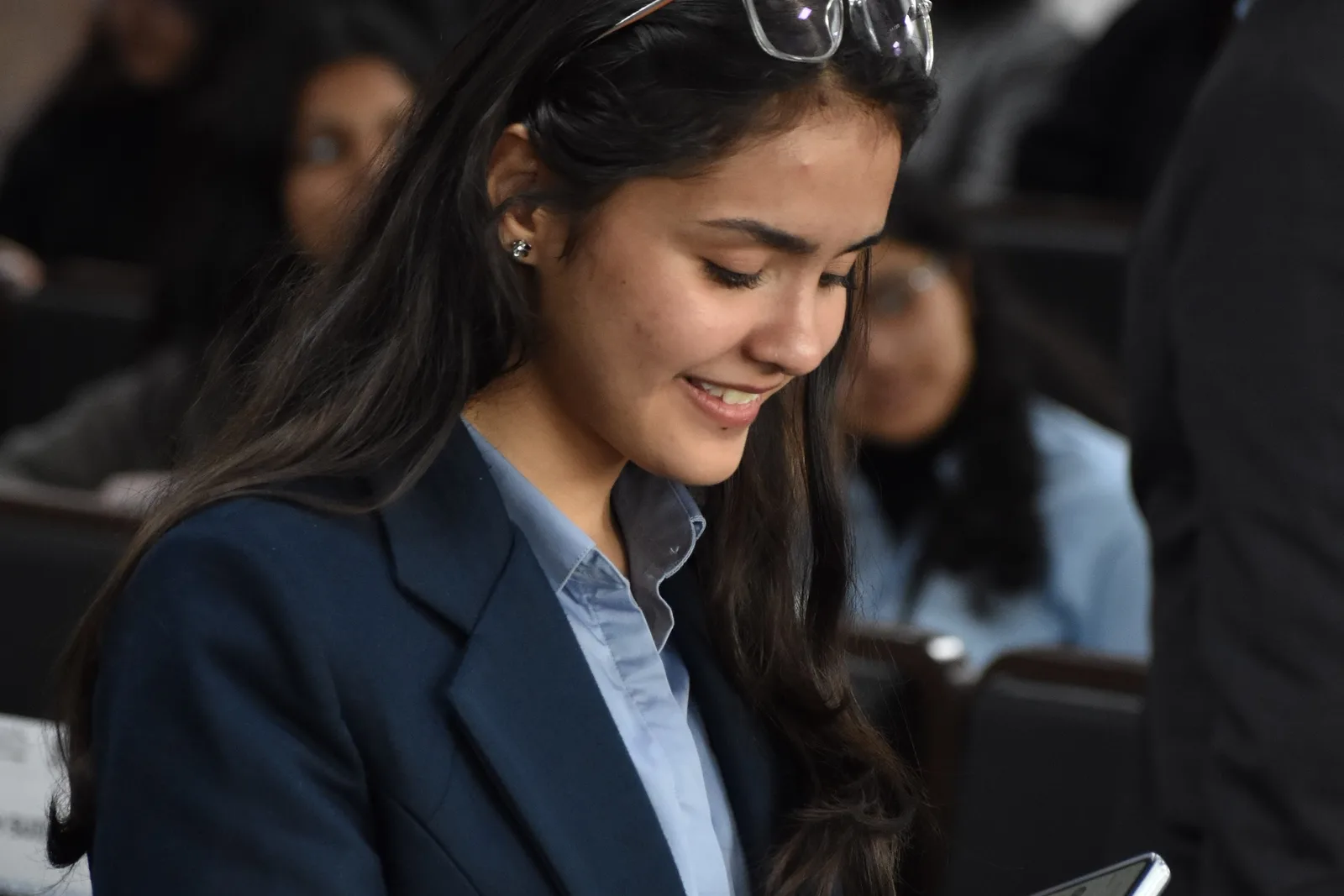 A delegate reading her notes before taking the floor