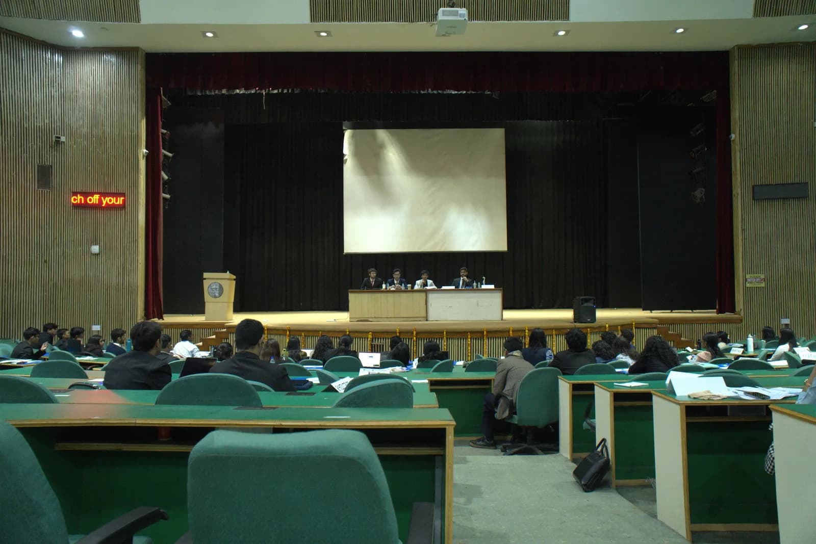 The auditorium from the rear with the executive board seated on stage